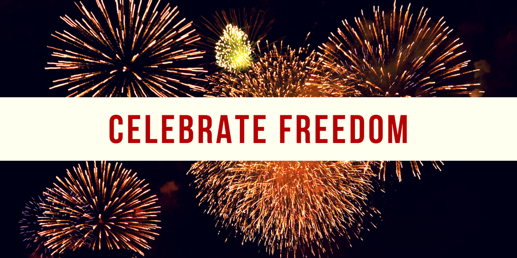Fireworks display with "Celebrate Freedom" banner