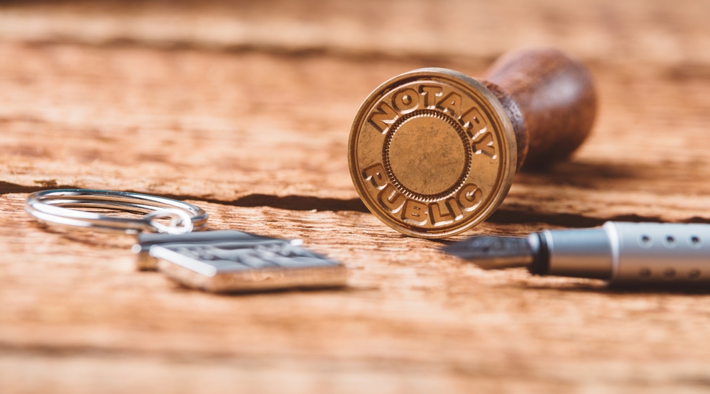 Notary public stamp with pen and keychain